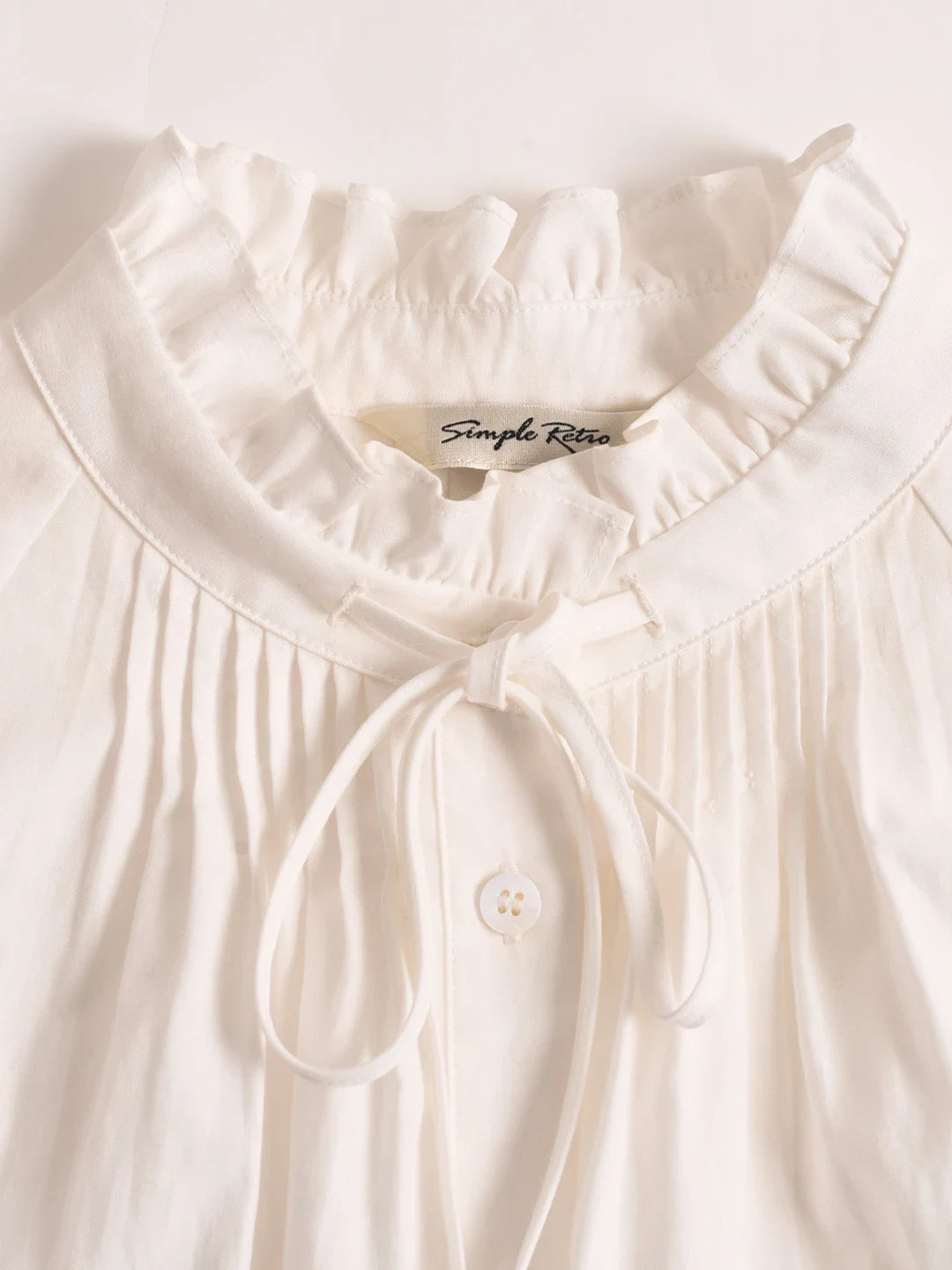 Kallie Ruffle Collar Hollow Blouse